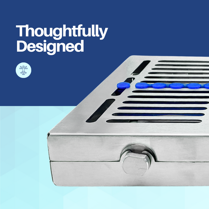 A thoughtfully designed, closed stainless steel dental instrument cassette shown from a side angle on a blue background.